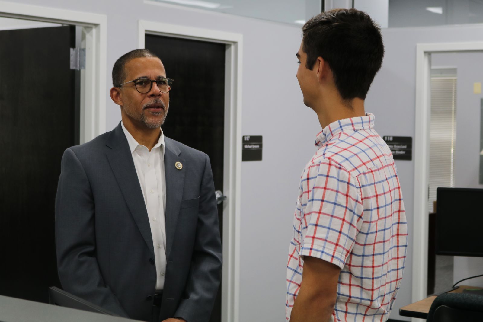 Congressman Brown speaks with UWT Intern Jackson Malmgren, who was working on a project coding trafficking routes and smuggling activities of transnational criminal organizations.